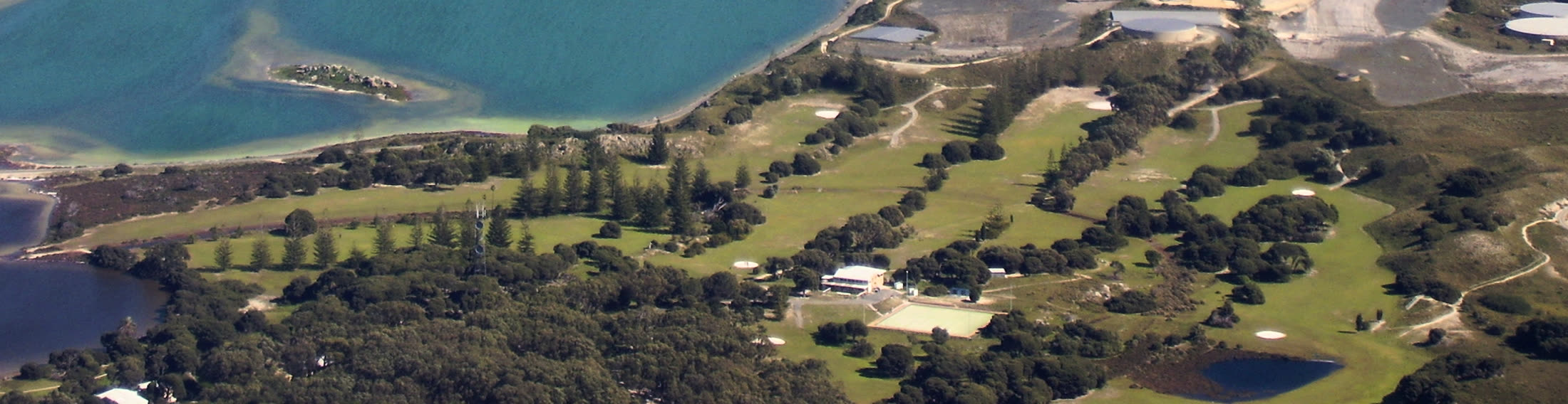 Aerial view of the Rottnest Island golf course beside the salt lakes
