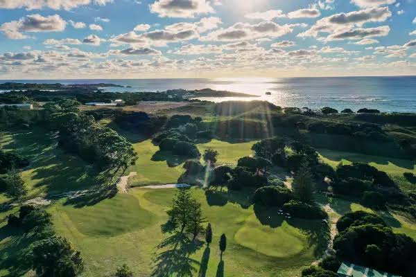 Low sun over the course and the ocean